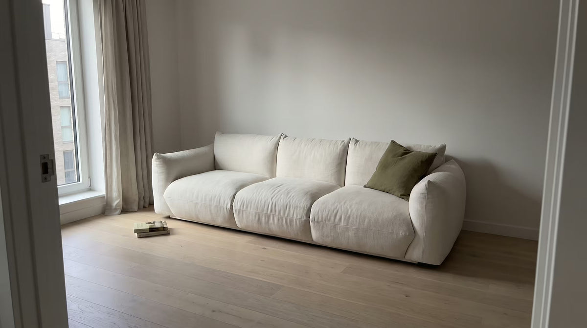 Ivory linen sofa in a daylight-filled modern living room