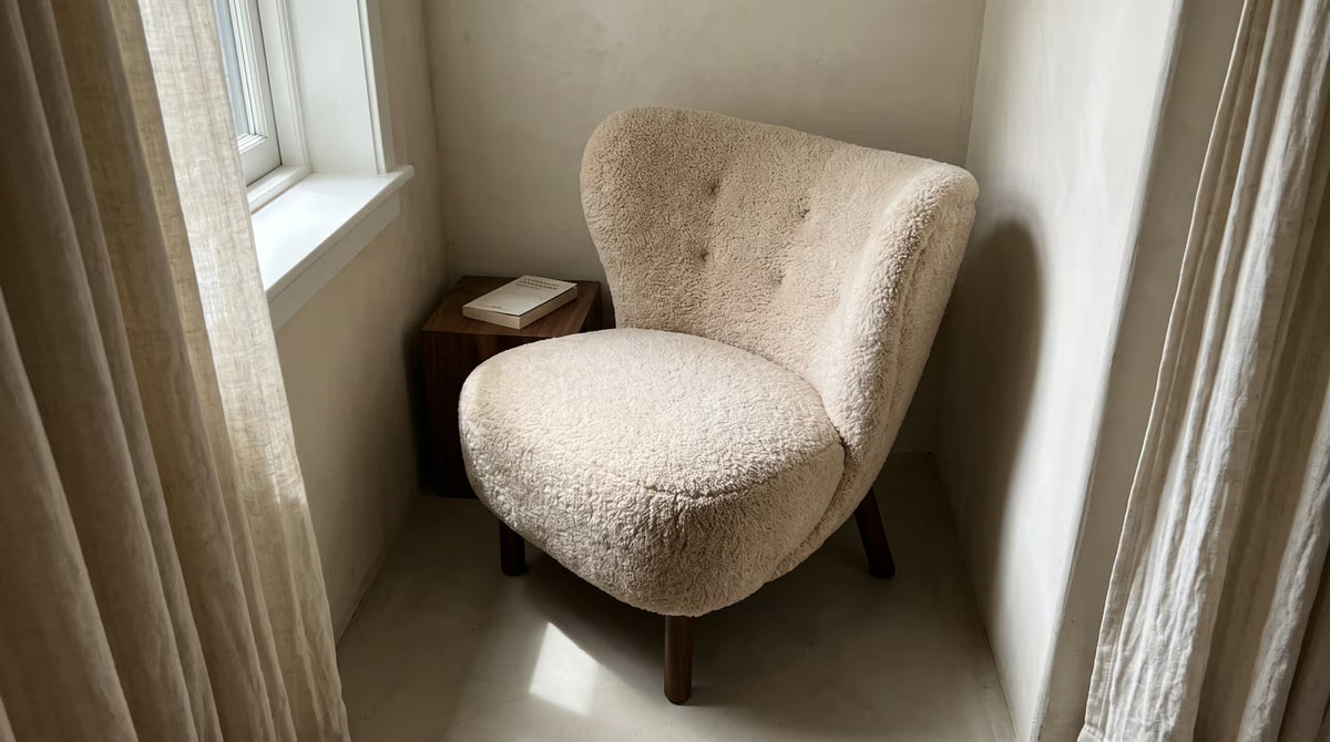 Almond plush Petral lounge chair in a reading corner